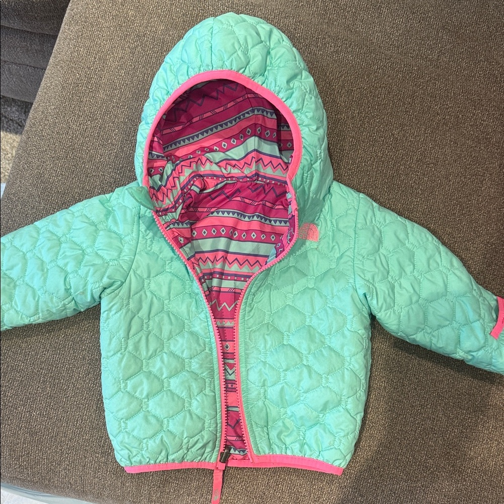 Mint green North Face quilted puffer  Jacket with Pink reservable option.
